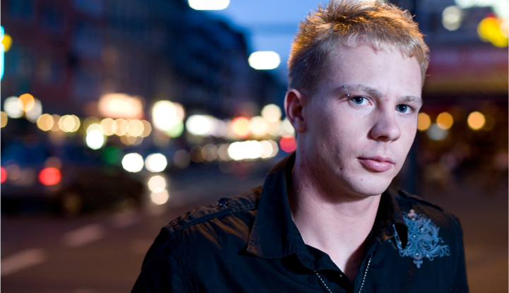 Person in front of city lights.